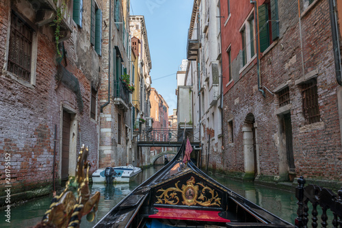 Panoramic view of Venice narrow canal with historical buildings from gondola