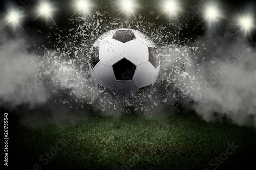 Traditional soccer ball on soccer field. Close up view of soccer ball  football  on green grass with dark toned foggy background
