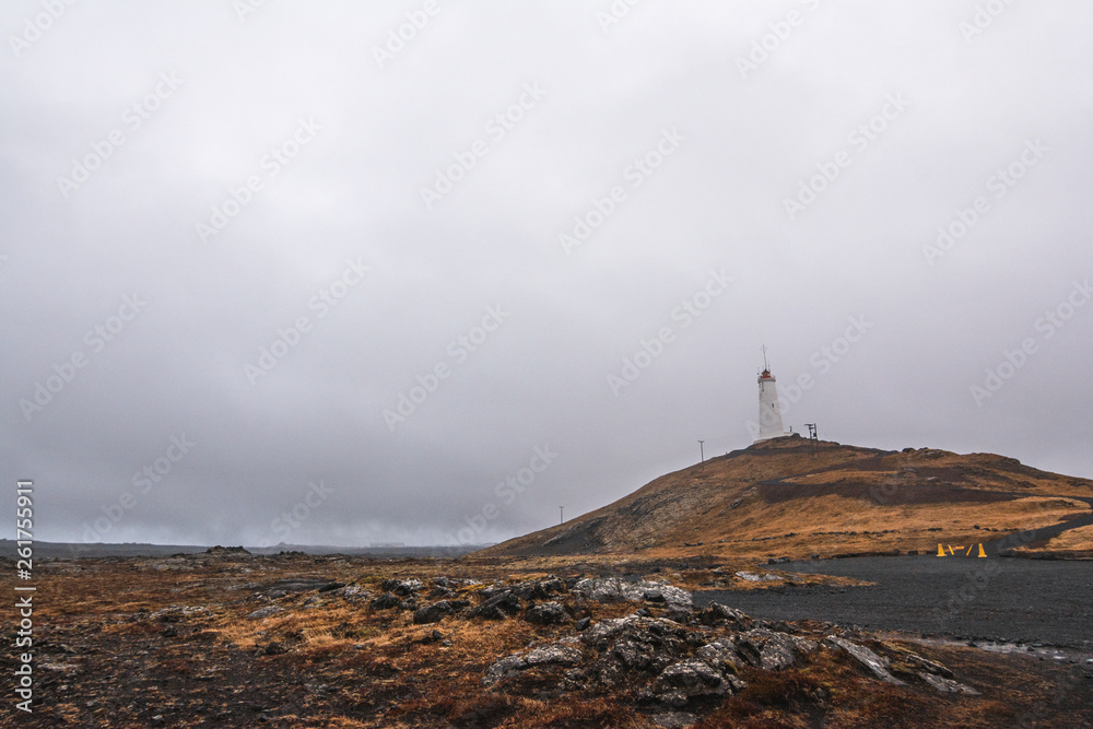 Lighthouse on the hill near the coast in Iceland