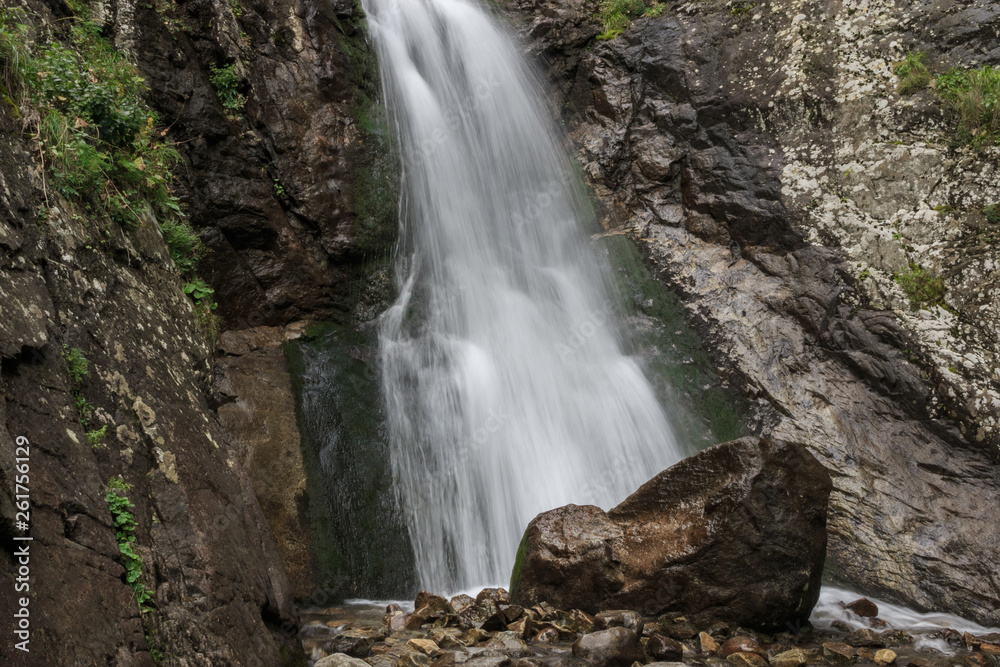 Closeup view of waterfall scenes in mountains, national park Dombay, Caucasus