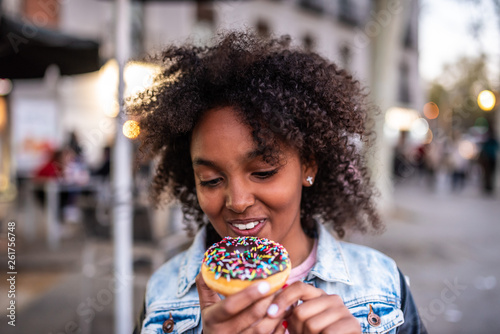 Photography Cute Little Girl Eating a Donuts.