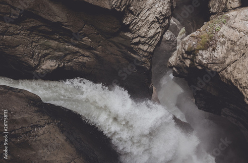 View closeup waterfall of Trmmelbach fall in mountains, valley of waterfalls photo