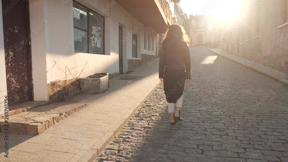 girl walking down the street
