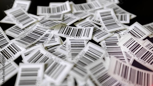 Red laser line is floating over printed barcodes stickers, line barcode reader over barcodes