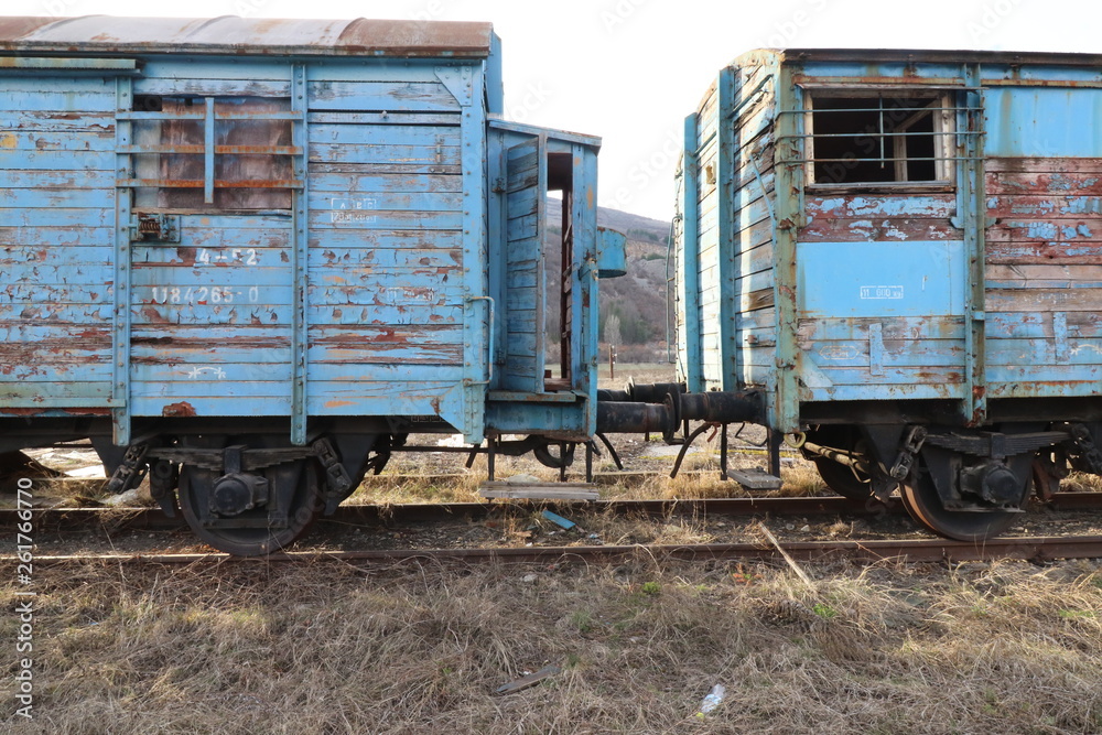 Abandoned old railway wagons at station, old train wagons in an abandoned station Inside this train station still stay wagons since the station was closed. Abandoned old railway wagons at station, old train wagons in an abandoned station Inside this train station still stay wagons since the station was closed.