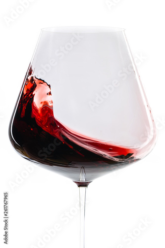 panning red wine in front of white background