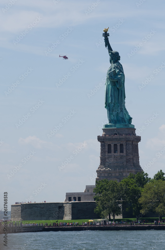 Fototapeta premium Statue of Liberty with helicopter, New York City