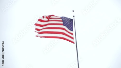 American flag super slow motion waves in wind on rainy day