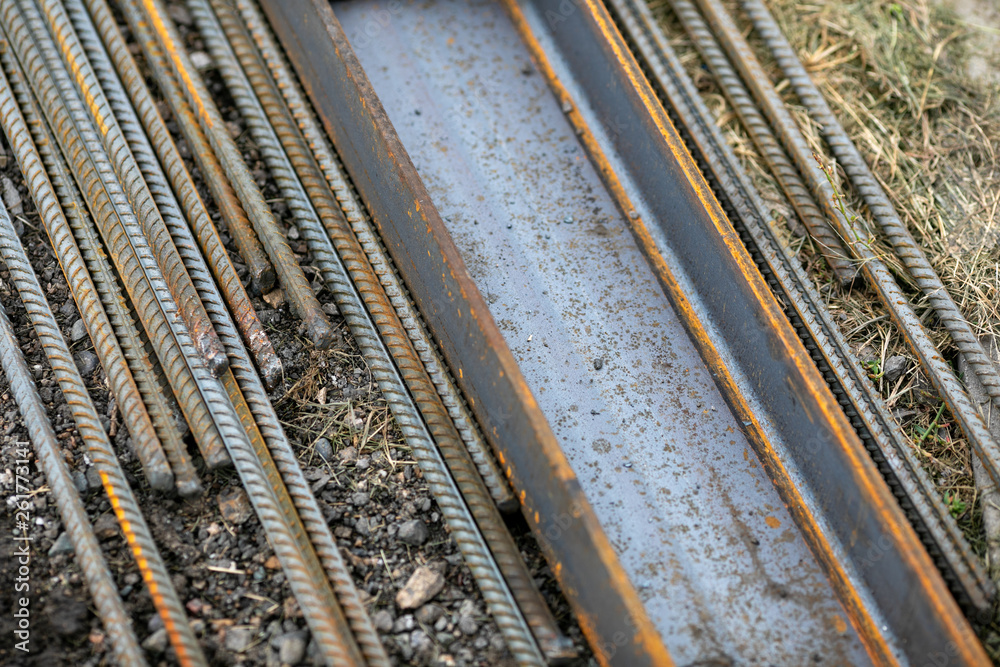 old rusty steel rods lay on the ground old rusty steel rods lay on the ground