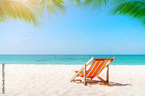 Beach chair on the tropical beach in Thailand with blue sky in sunny day. Summer vacation and holiday.