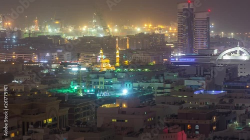 Wallpaper Mural Aerial view over Port Rashid illuminated at night during sand storm timelapse in Dubai, United Arab Emirates. Buildings and roads from above Torontodigital.ca