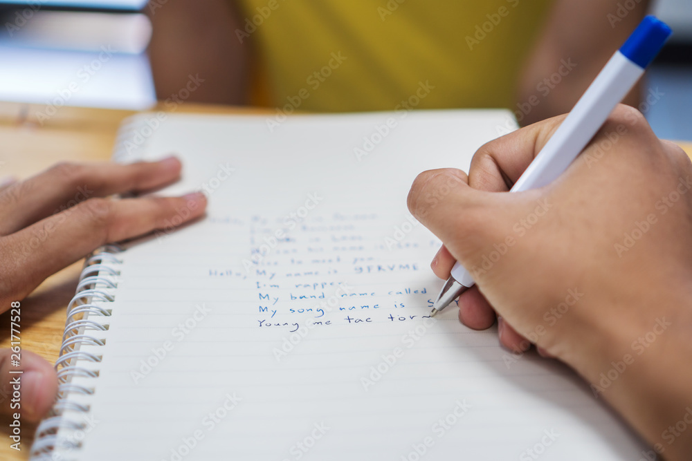 Asian Student note on notebook while learning study and writing for planning work. Studying in Education at university concept. Back to school Asian Student note on notebook while learning study and writing for planning work. Studying in Education at university concept. Back to school
