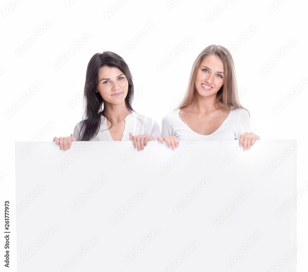 in full growth.two smiling business woman with blank Billboard in full growth.two smiling business woman with blank Billboard
