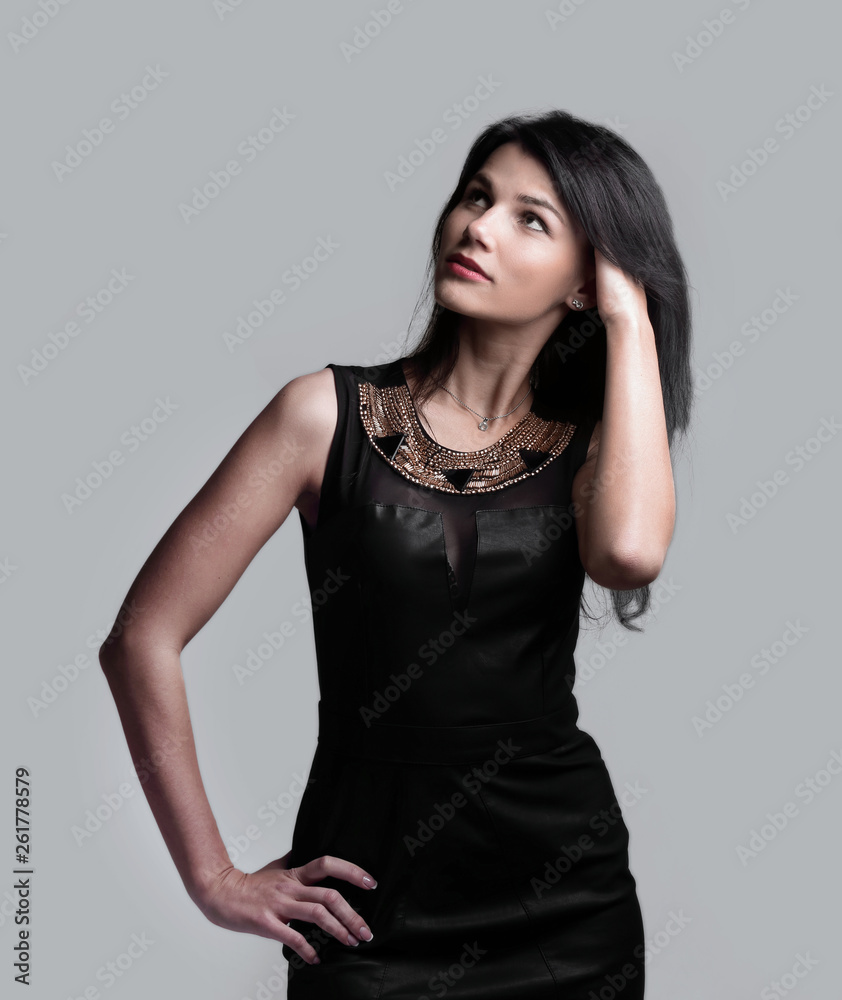 modern young woman in black dress . isolated on grey modern young woman in black dress . isolated on grey