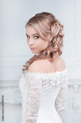 girl bride in wedding dress in beautiful stylish hairstyle