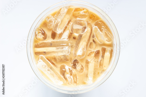 Top view of glass of iced coffee on white background