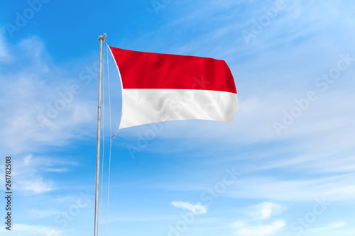 Indonesia flag over blue sky background