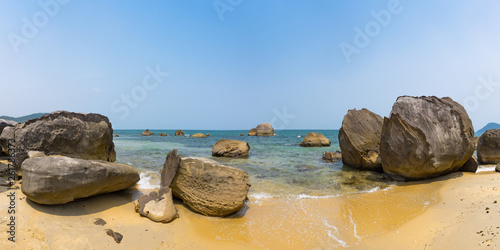 Seascape. View of the sea from the rocky beach of a tropical island