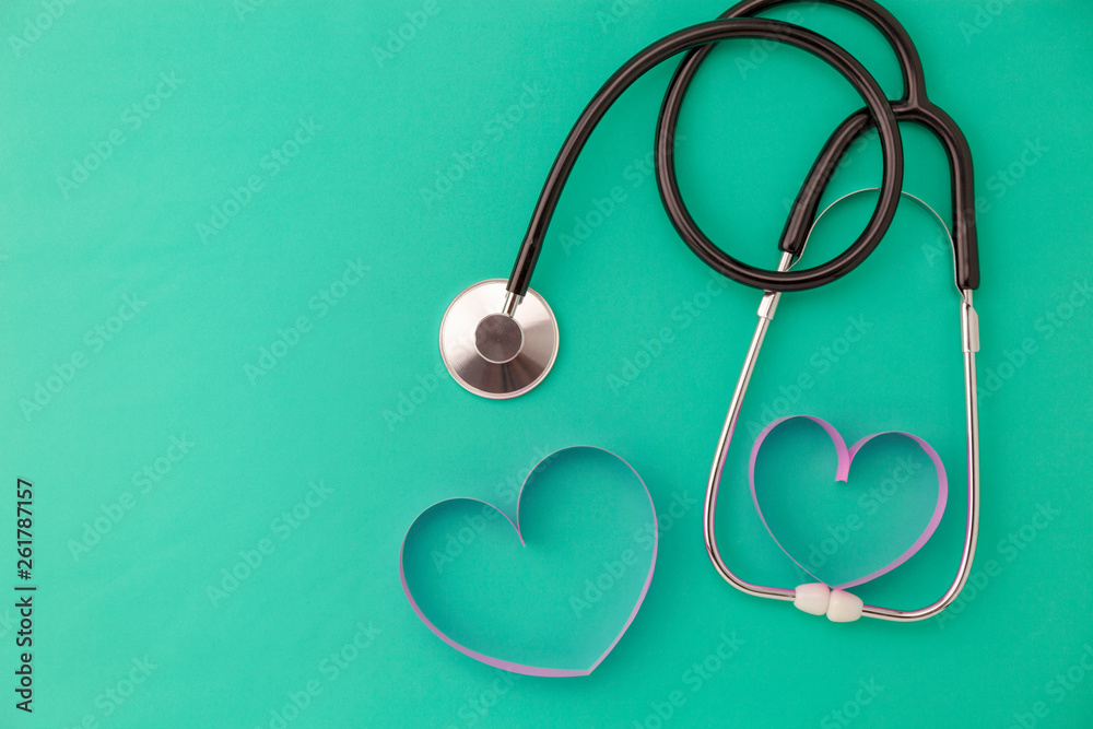 World health day background,Stethoscope and pink ribbon heart on green background,Concept healthcare and medical background World health day background,Stethoscope and pink ribbon heart on green background,Concept healthcare and medical background