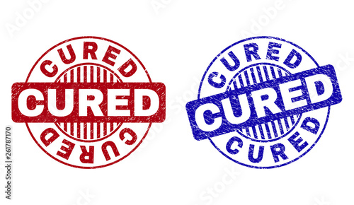 Grunge CURED round stamp seals isolated on a white background. Round seals with grunge texture in red and blue colors. Vector rubber imitation of CURED text inside circle form with stripes.