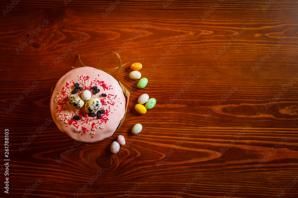 Easter cake on wooden background.Copy space.Wood texture.Holiday spring design.Top view.Happy Easter. Easter cake on wooden background.Copy space.Wood texture.Holiday spring design.Top view.Happy Easter.