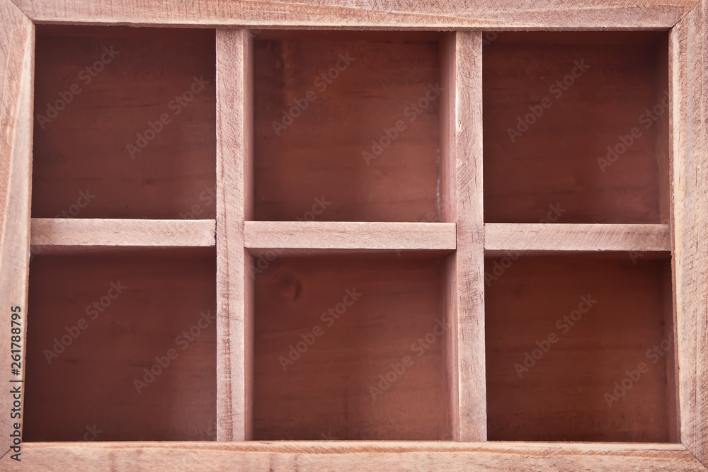 A empty wooden box with sections , top view. A empty wooden box with sections , top view.