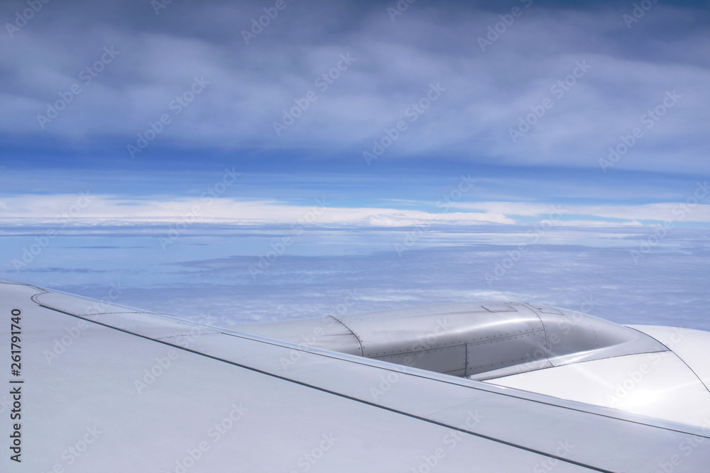 plane wing and cloud floating on sky through window frame plane wing and cloud floating on sky through window frame