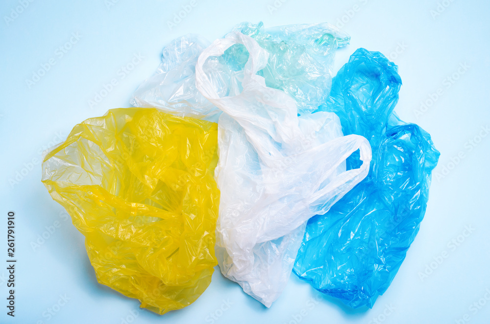 Fototapeta premium Plastic Bags on Blue Background, Recycle and Plastic Pollution Concept