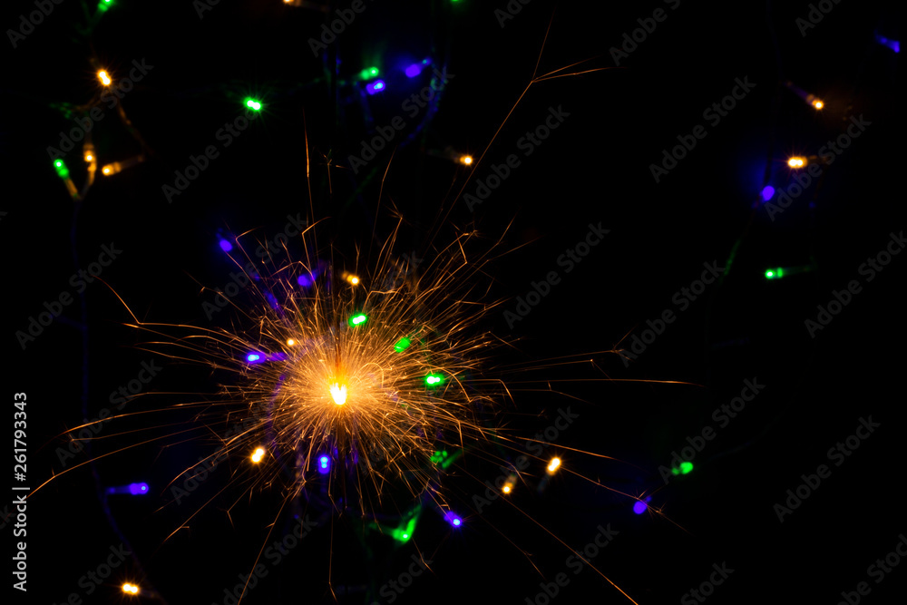 sparkler with blur new year's light close up sparkler with blur new year's light close up