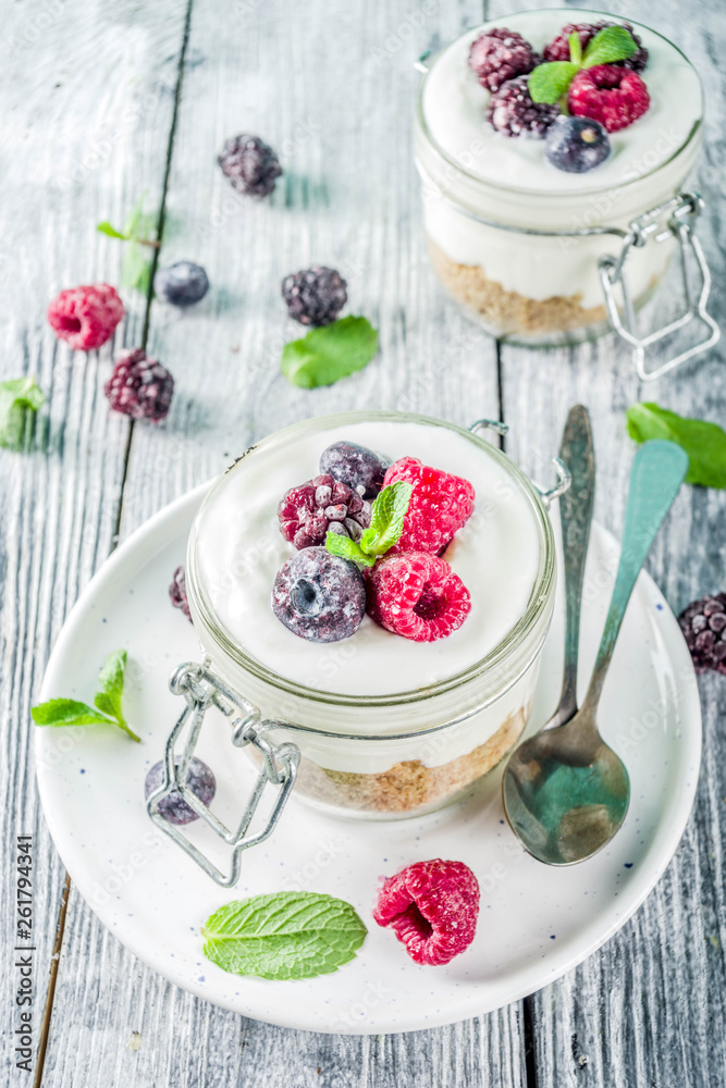 Cheesecake in portioned jars with summer berries Cheesecake in portioned jars with summer berries