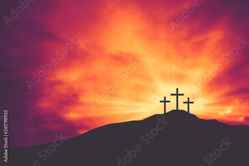 Three Christian Easter and Good Friday Holiday Crosses on Hill of Calvary with Colorful Clouds in Sky - Crucifixion of Jesus Christ Background