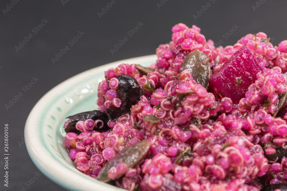 Obraz premium pink quinoa salad with beetroot and pumpkin seeds