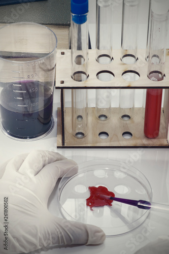 Lab tube, eppendorfs with red liquid. White background. Studio shot. photo