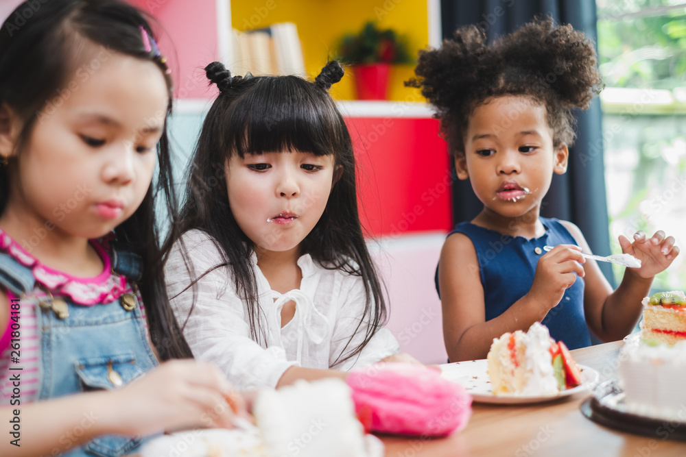 Diversity girl kids eating sweet cake Diversity girl kids eating sweet cake