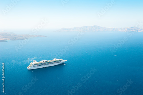 Cruise ship in the sea near the Santorini island, Greece. © smallredgirl