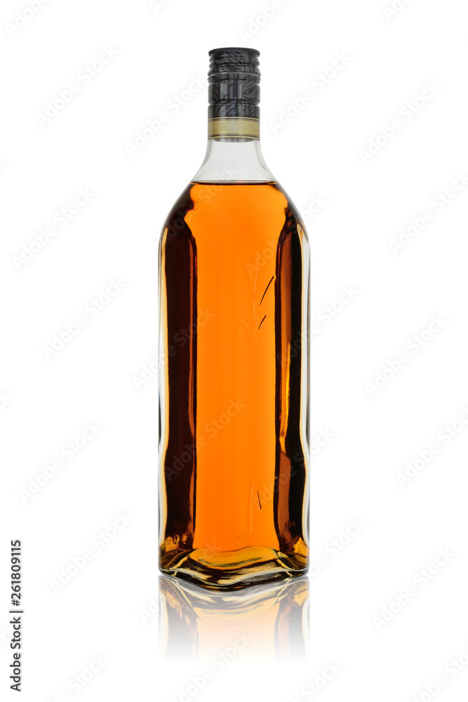 Glass bottle of alcoholic drink rum or brandy with reflection. Isolated on a white background