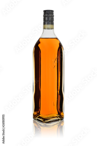 Glass bottle of alcoholic drink rum or brandy with reflection. Isolated on a white background