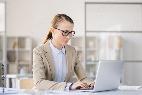 Busy woman preparing presentation on laptop