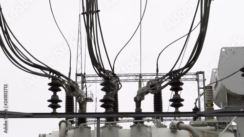 Electrical transformer substation. Power transformer at a power station. Fan cooling power transformer. High voltage transmission power line.