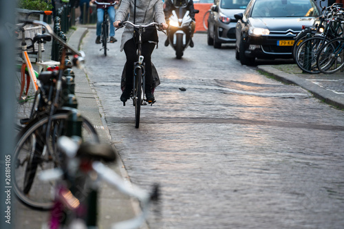 People ride a bicycle in the city