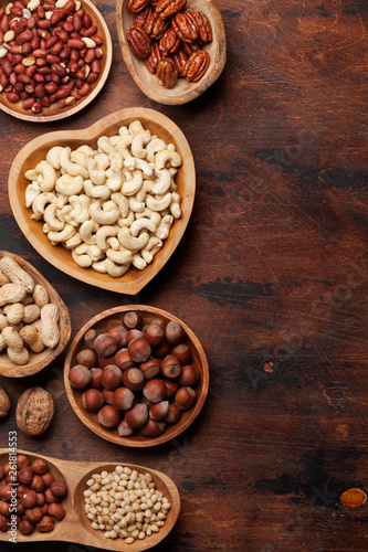 Various nuts selection on wooden table