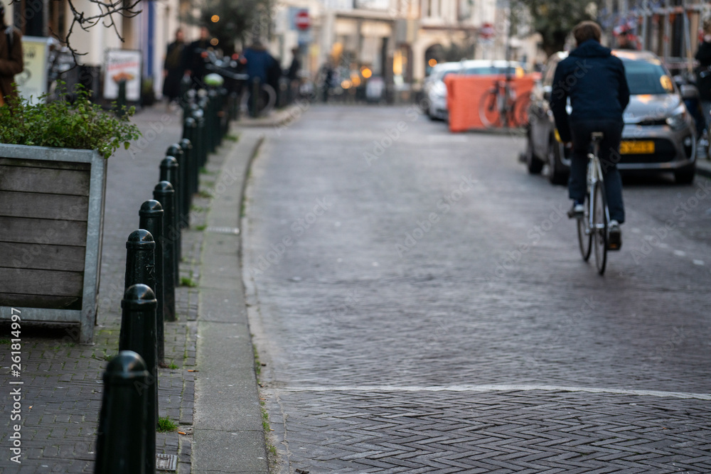 A man ride a bicycle in the city