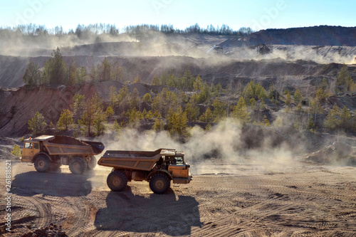 The work of heavy machinery and mining trucks for the transport of bulk mining materials and other minerals in the open pit mine