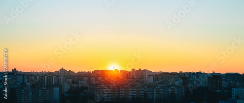 panorama of sunset in the city  sleeping area  high-rise buildings of the 2000s
