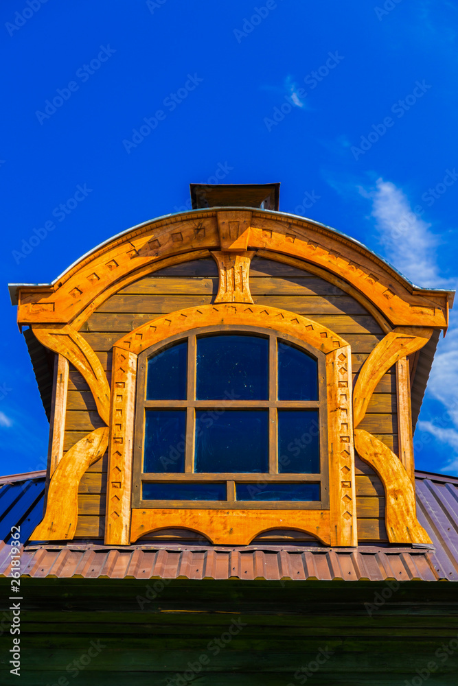 Obraz premium Framed window on the tile roof