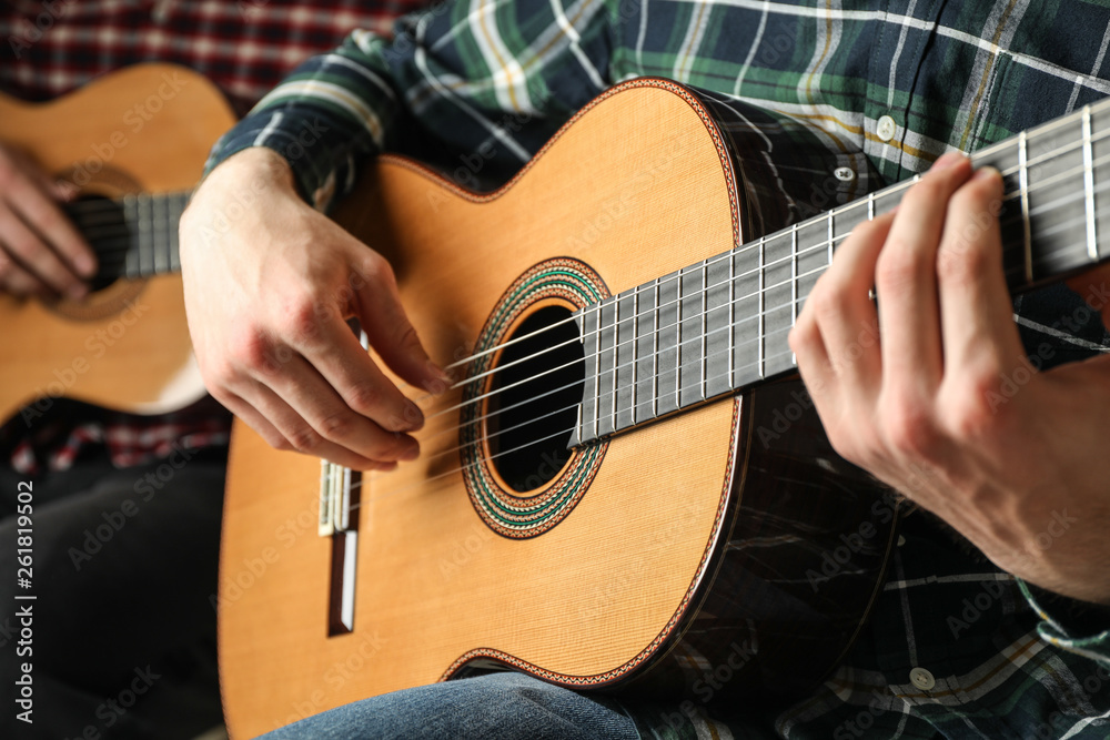 Fototapeta premium Two guitar players with classic guitars, space for text