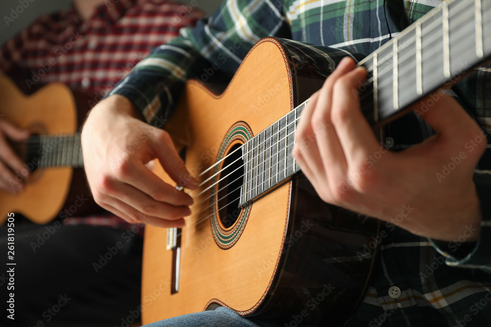 Fototapeta premium Two guitar players with classic guitars, space for text