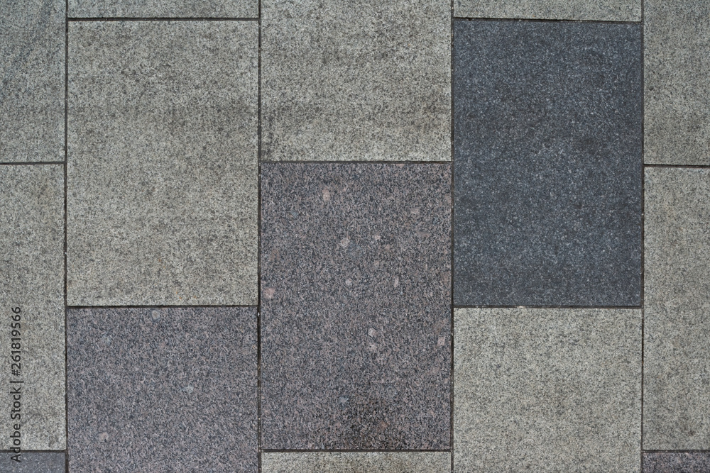 Obraz premium Gray granite. Rectangular pavement slab. Top view.