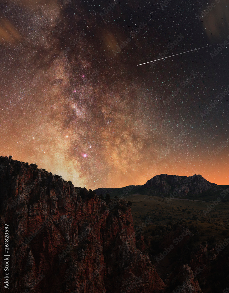 Beautiful red rocks and the close up milky way galaxy.