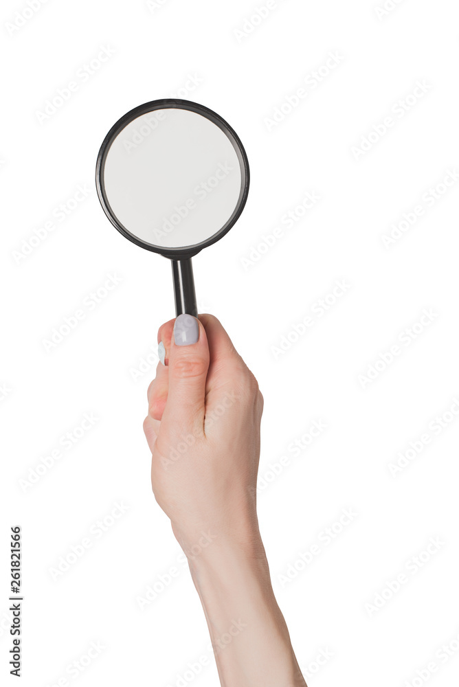 Female hand holding magnifier isolate on white background Female hand holding magnifier isolate on white background